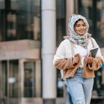 woman walking in campus checking when do barnard decisions come out