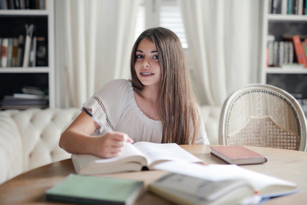 female student looking into summer literature programs for high school students