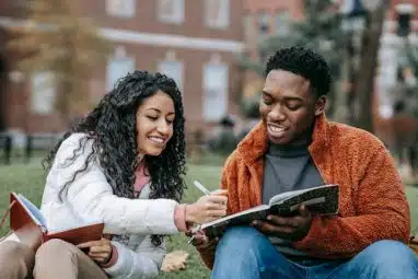 two smiling students discussing the rice application deadline