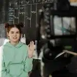 student in front of the camera for the Carolina Journalism Institute program