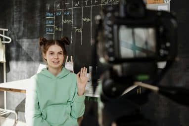 student in front of the camera for the Carolina Journalism Institute program