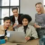 students checking laptop for the class rank reporting on the common app