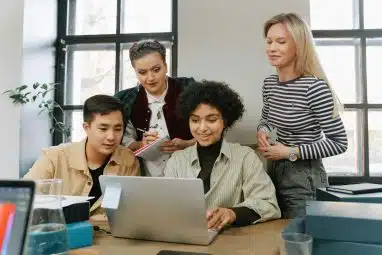 students checking laptop for the class rank reporting on the common app