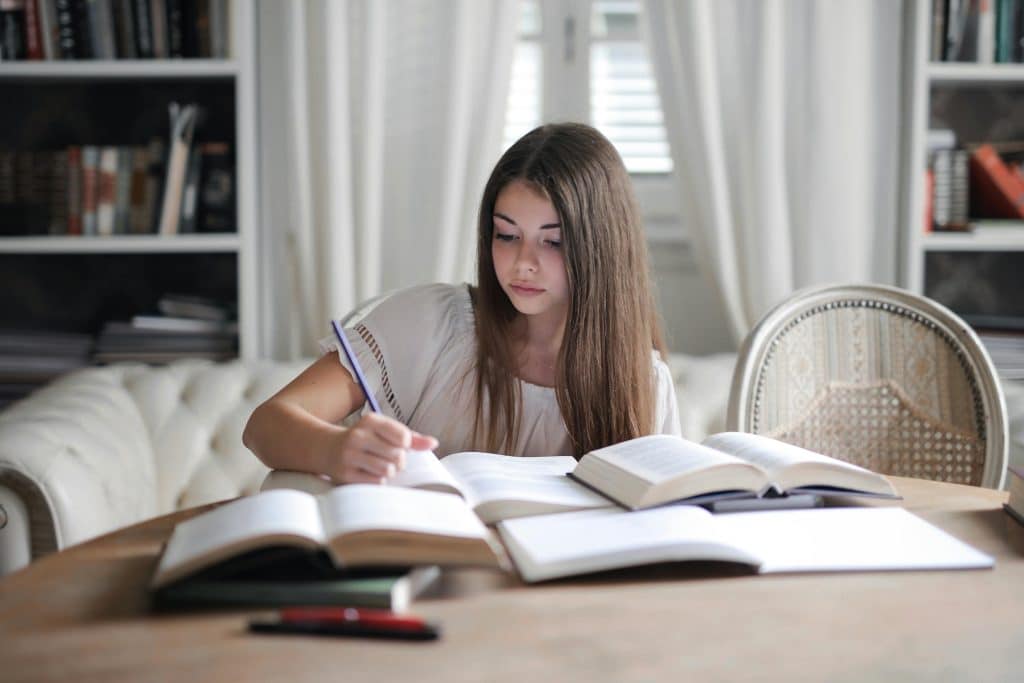 A female student writing UMich supplemental essays