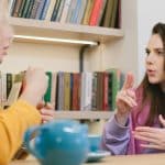 students discussing about joining the summer language programs for high school students