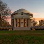 The Rotunda at the University of Virginia campus at sunset, with columns and fall trees in the foreground, representing UVA application deadline.