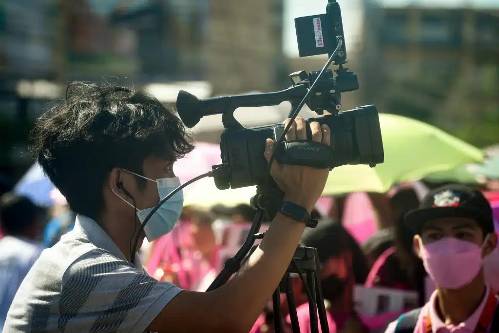 A high school student working for his school's campus journalism organization, which got recognized by Quill and Scroll.