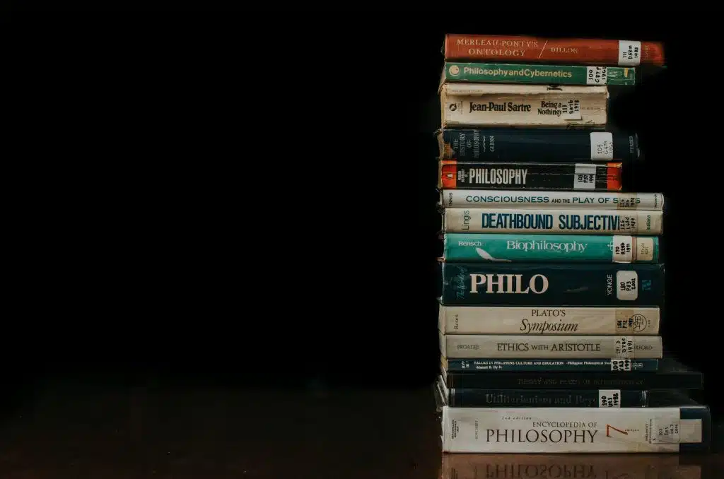 A stack of philosophy books used by students in the best colleges for philosophy.