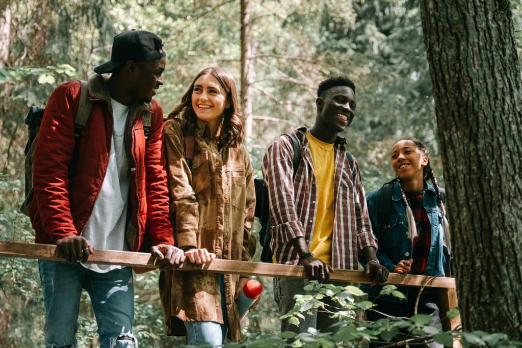 High school students collaborating outdoors during the Columbia Climate School in the Green Mountains, exploring nature and discussing climate topics