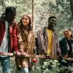 High school students collaborating outdoors during the Columbia Climate School in the Green Mountains, exploring nature and discussing climate topics